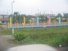 Naranjal-Machala, pasaje de un pueblo,
                          parque infantil en la calle principal (01)