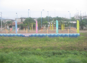 Naranjal-Machala, pasaje de un pueblo,
                          parque infantil en la calle principal (02)
