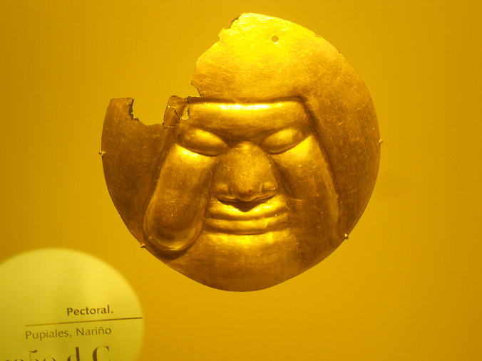Columbia's Nari�o Culture: Breast
                pendant with face mask