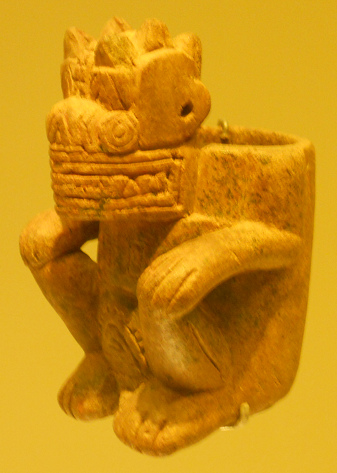 Columbia's Calima Culture: alien god
                        with adog's nose 02 with circular eyes and
                        triangular teeth