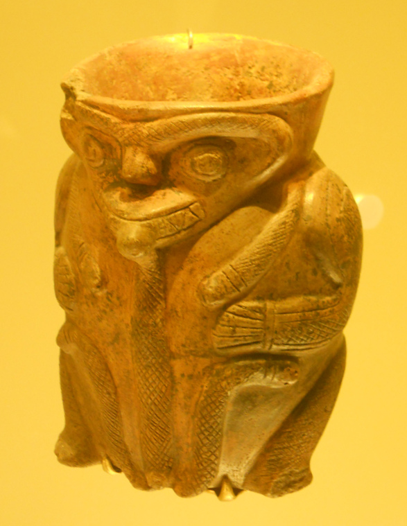 Columbia's Calima Culture: alien god
                        with dog's snout 03 with ball eyes and
                        triangular teeth