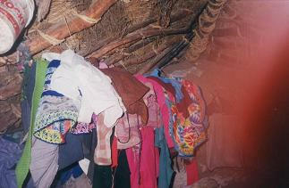 Dwelling house 05: A post on the ceiling is
                      replacing a wardrobe, and there is a finger fault
                      on the photo