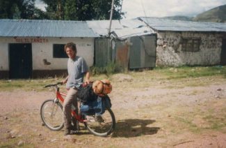 On Via Libertadores, French cyclist, metal
                      huts in the background
