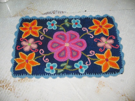 Tischuntersetzer in Blau (30 Soles, 12
                        Dollar)