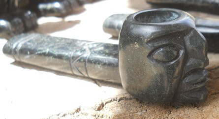 Handicraft workshop in Cusco Sacsayhuam�n,
                    black pipe with a men's face with a hooked nose