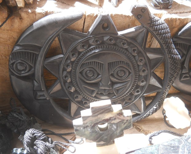Handicraft workshop in Cusco Sacsayhuam�n:
                    combination of figurines with a moon with a face,
                    with a sun with a face, and with a snake 02 - zoom