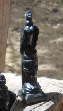 Handicraft workshop in Cusco Sacsayhuam�n,
                    black figurines 06, an eagle on a women's head