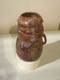 Vessel in form of a pan flute
                                    player