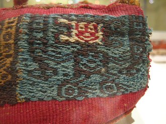 Cap of Wari culture 04, detail
                                  02, a smiling god